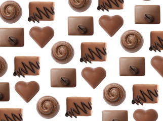 Set with different chocolate candies on white background, top view
