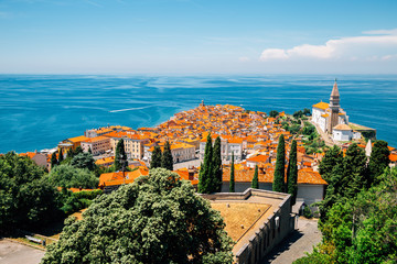 Panoramic view of Piran old town and Adriatic sea with St. George's Parish Church in Slovenia