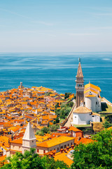 Panoramic view of Piran old town and Adriatic sea with St. George's Parish Church in Slovenia