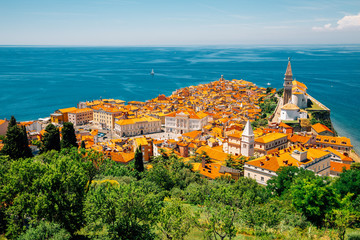 Panoramic view of Piran old town and Adriatic sea with St. George's Parish Church in Slovenia