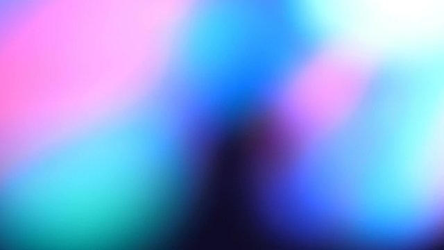 Bright multi-colored rays move in a stream of smoke and create beautiful flares on black background. Slow mo, slo mo, slow motion, high speed camera
