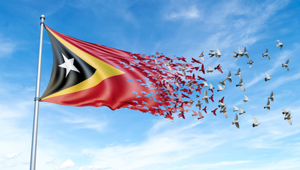 East Timor flag on a pole turn to birds while waving against a blue sky background - 3D illustration.