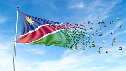 Namibia flag on a pole turn to birds while waving against a blue sky background, 3D illustration.
