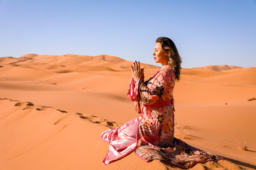 A girl in a beautiful Moroccan dress. Merzouga Morocco.