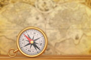 Gold compass on old map background. 3D illustration.