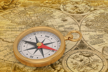 Fototapeta na wymiar Gold compass on old map background. 3D illustration.