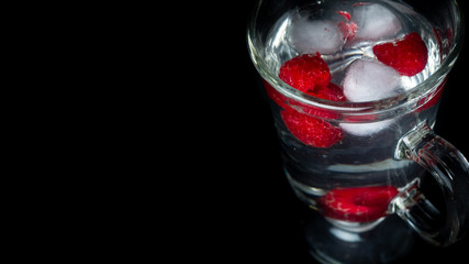 
Raspberry with ice in a water glass. Ready for entry.