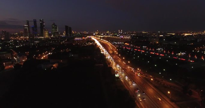 Victory Park 4K night aerial video with background view of Moscow City Business Center, Kutuzovskiy Avenue busy road traffic, memorial complex in Poklonnaya Hill, near Moscow River in Moscow, Russia