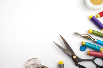Copyspace frame with sewing tools and accesories isolated on white
