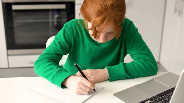 Little school girl becoming furious, cant solve math equation, hard home task