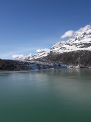 Alaska glacier, lake, canal, mountains and snow with a clear blue sky on a sunny spring day 2018