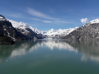 Naklejka na ściany i meble Alaska glacier, lake, canal, mountains and snow with a clear blue sky on a sunny spring day 2018