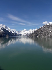 Obraz na płótnie Canvas Alaska glacier, lake, canal, mountains and snow with a clear blue sky on a sunny spring day 2018