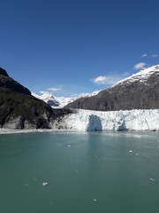 Fototapeta na wymiar Alaska glacier, lake, canal, mountains and snow with a clear blue sky on a sunny spring day 2018