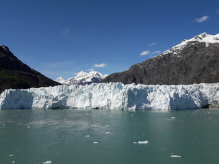 Alaska glacier, lake, canal, mountains and snow with a clear blue sky on a sunny spring day 2018