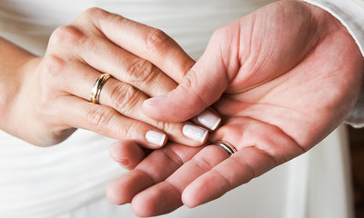 Newly married hands with gold rings