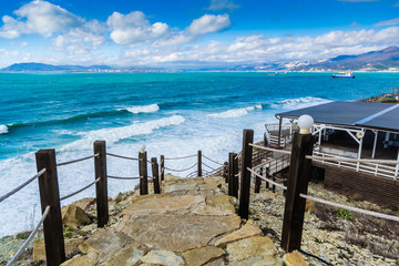 Cape Doob. The storm and waves of the Bay Tsemess. Ships on the roadstead of Novorossiysk. A stone...