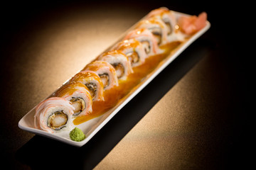 sushi rolls on a black table