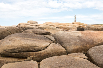 Coastal rocks and lighthouse in Cabo Polonio, Uruguay