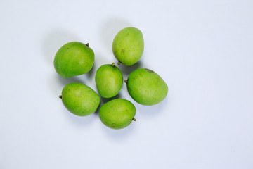 Fresh ripe green color mangoes isolated on white background