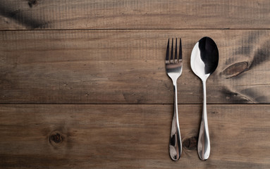 spoon and fork on wood background, cutlery
