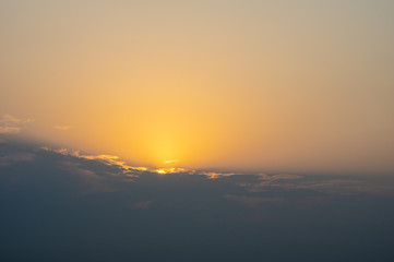 Sun Rising over the clouds