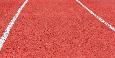 Background of red treadmill, stadium.