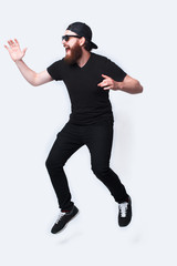 Full length photo of young bearded man jumping