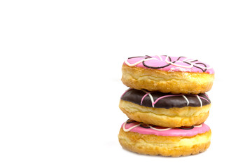 Colorful donuts stacked isolated on white