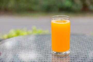 Orange juice with bokeh nature