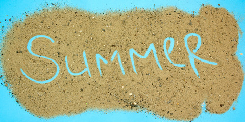 word summer written in the sand, concept of summer vacation and travel, sea and beach