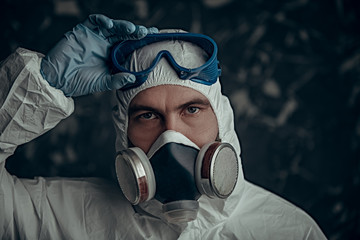 bacteriologist in respiratory mask