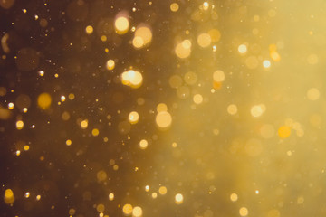 Dark Abstract Gold bokeh sparkle on black