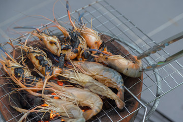 Fresh shrimp grilled bbq seafood on charcoal stove