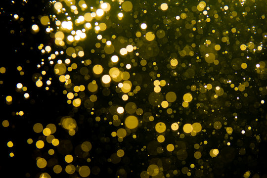 Golden blur glitter lights abstract bokeh for Merry Christmas and New Year © pandaclub23