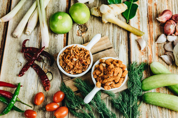 Roasted chili paste on a plate Taken with the assembly And vegetable side dishes Shot on a wooden floor backdrop