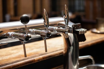 chrome beer taps in bar