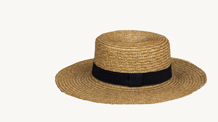 Fototapeta na wymiar Summer fashion straw hats and personal items and holiday concept themes with separate straw hats or black straps on a white background.