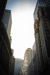 Low Angle View of urban Scene in Manhattan with ancient and modern Skyscrapers - Copy Space