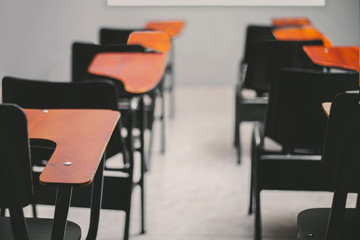 close-up of empty desks in classroom, concept social distancing