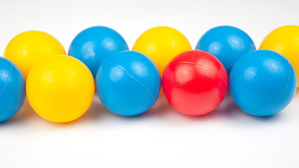 Colored plastic balls on white background. leisure and game items. round objects