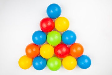 Colored plastic balls on white background. leisure and game items. round objects