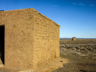 Abandoned and derelict mud and straw brick farmhouse in Tankwa Karoo Park South Africa