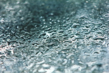 fresh raindrop in nature on clean glass for background