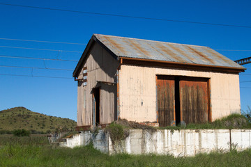 Abandoned and derelict store on railway station in South Africa