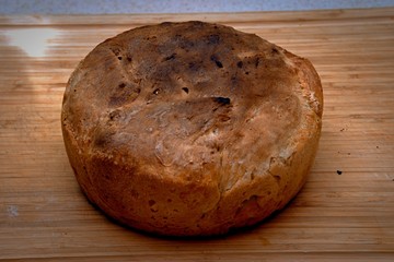 Handmade freshly baked wheat bread on the wooden desk