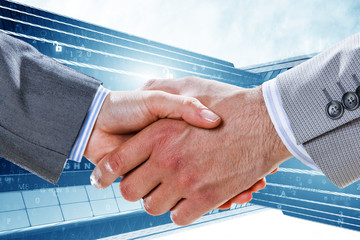 Partnership concept. Image of handshake