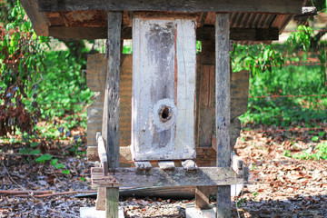Wood box bee house in farm background