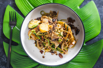 plant-based food, vegan lentil and potato bake with zucchini noodles