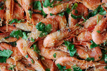 Fresh boiled prawns with coriander. A delicious dish of seafood.